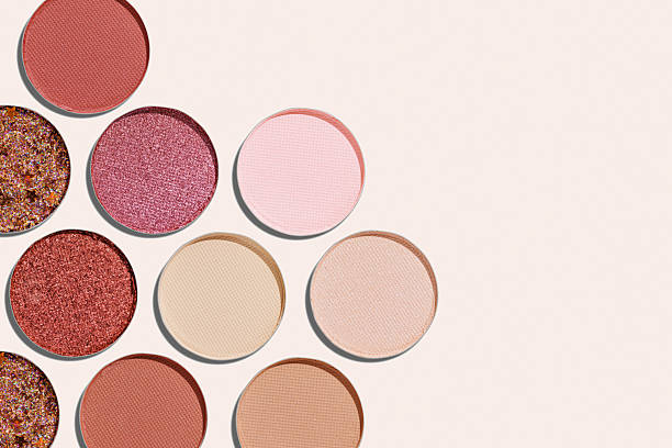 istock Cosmetics texture pattern, Warm vivid colored eye shadow makeup palette, round eye powder swatches. Female cosmetic and beauty products, aesthetic minimal beauty photo, colorful eyeshade, top view 2238702426