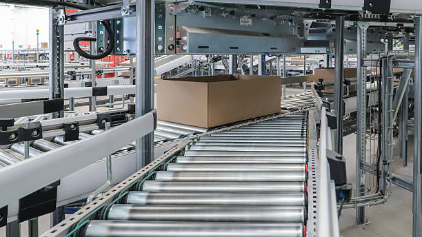 istock packing line in a logistics warehouse. conveyor belt in a modern production line 2238704223