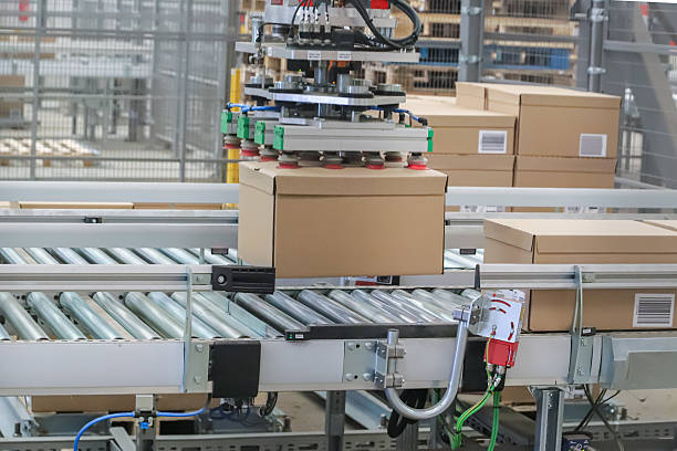 istock packing line in a logistics warehouse. conveyor belt in a modern production line 2238704232