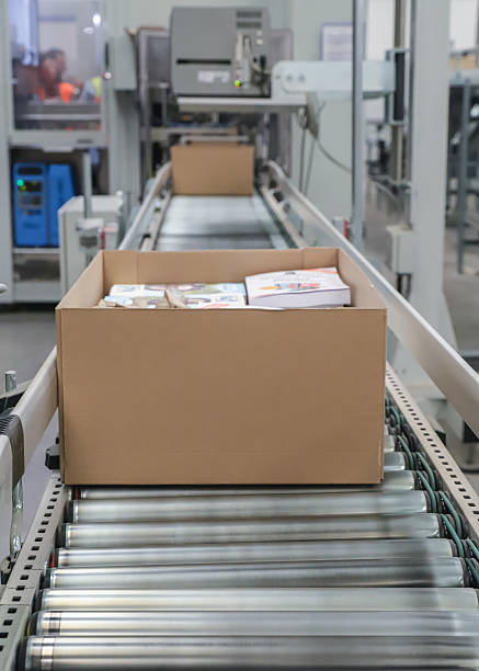istock packing line in a logistics warehouse. conveyor belt in a modern production line 2238704238