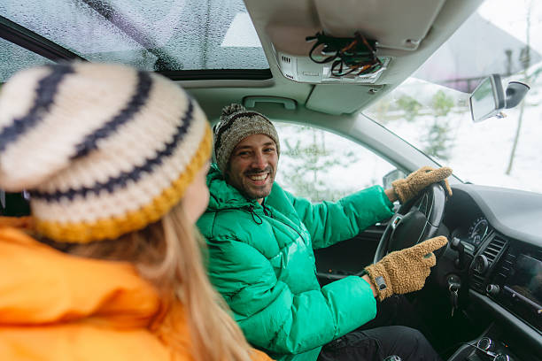 istock Smiling couple on a winter road trip 2238706467