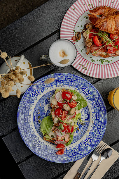 istock Sandwich with tomato and fish on a blue plate autumn vibe 2238706635