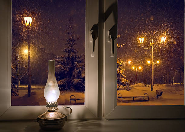 istock Cozy Winter Night Scene Through Window with Oil Lamp 2238708642