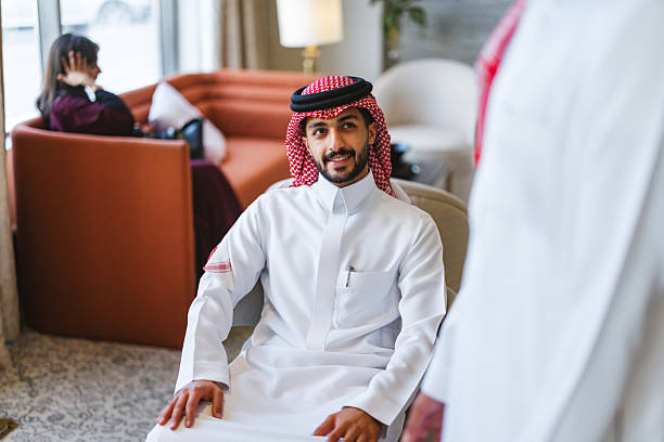 istock Middle Eastern Businessmen in Confident Discussion at Hotel Lobby 2238709406