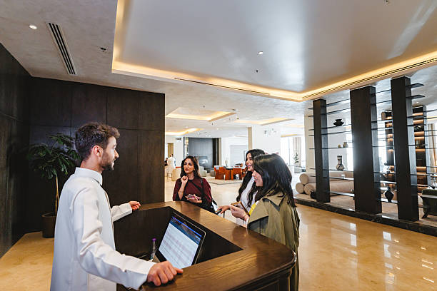 istock Middle Eastern Women Checking in at Hotel Reception 2238709488