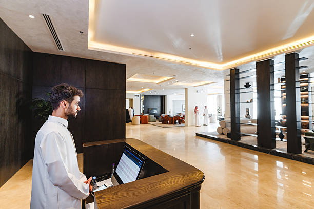 istock Arabic Male Managing Hotel Reception Desk with Focused Expression 2238709495