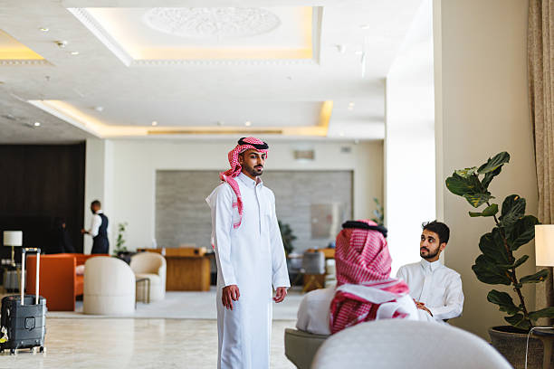 istock Arabic Businessmen Engaging in Conversation in Modern Hotel Lobby 2238709749