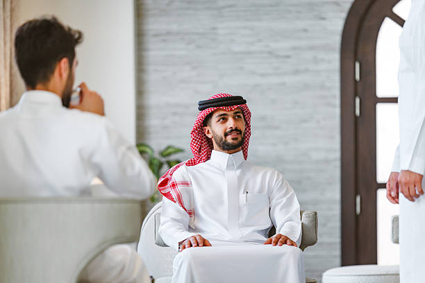 istock Confident Middle Eastern Businessmen Discussing in Hotel Lounge 2238709998