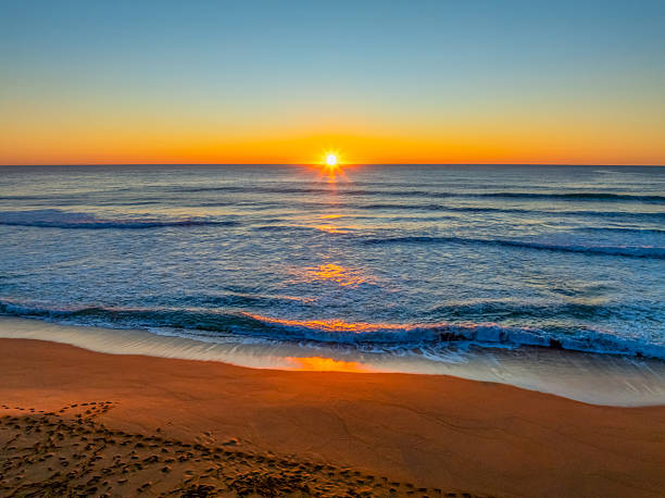 istock Sunrise at the seaside with a cloudless sky 2238710255