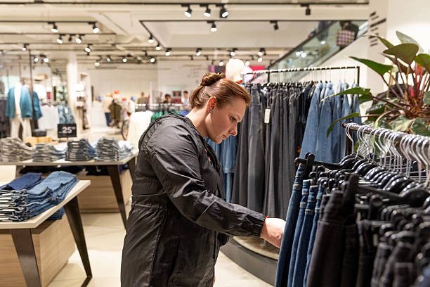 istock Shopping in a clothes store 2238710306