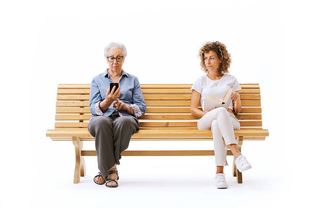 istock Women of different ages sitting on a bench 2238710424