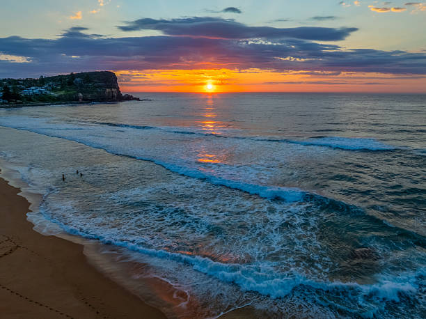 istock Seaside Sunrise Under a Cloud-Filled Sky 2238710572