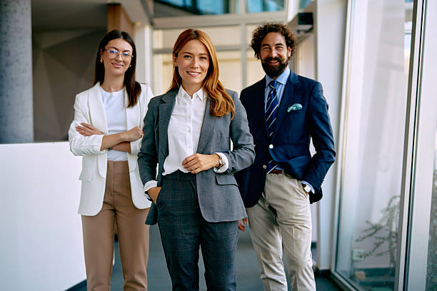 istock Business team standing in modern office environment 2238714103