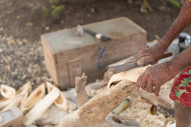 istock Artisan hands sanding a traditional wooden sculpture 2238718196