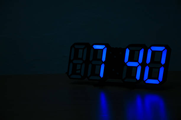 istock The digital clock on the table shows 07.40 2238718427