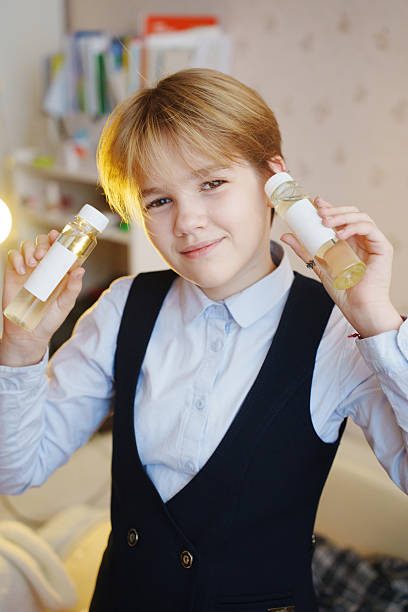 istock Child holding aroma diffuser liquid in a cozy indoor setting 2238718567