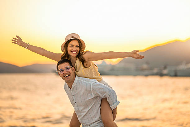 istock Couple having fun at waterfront on a summer vacation at sea. 2238719936