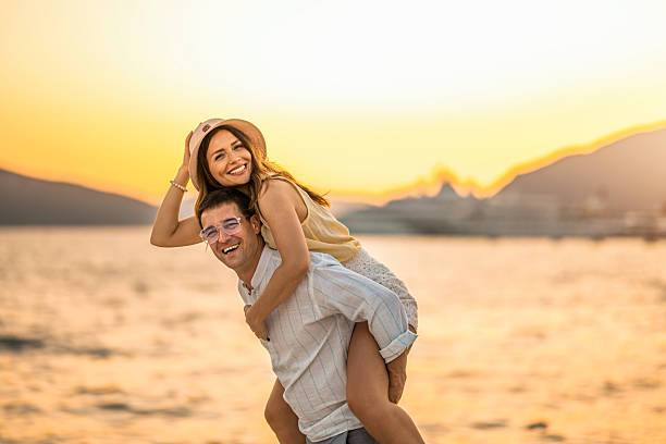 istock Couple having fun at waterfront on a summer vacation at sea. 2238720119