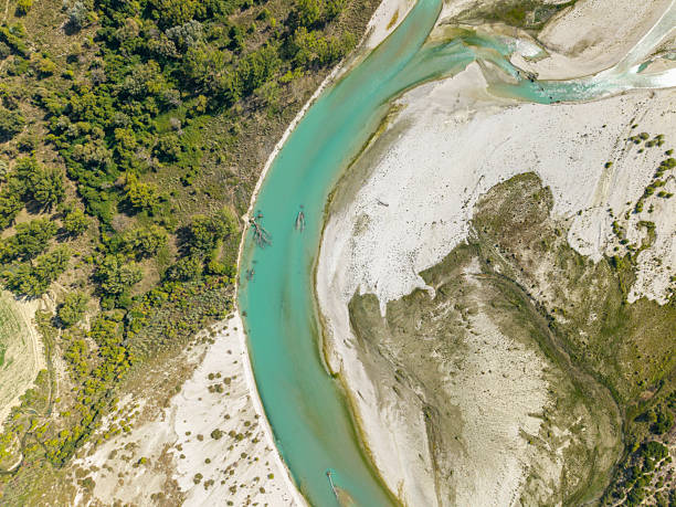 istock Aerial View of Turquoise River Bend and Forest 2238720192