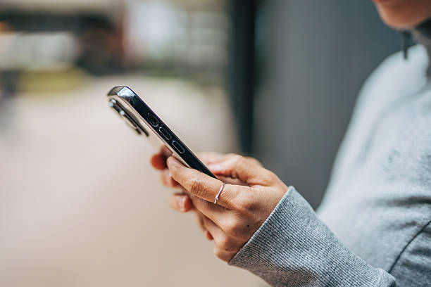 istock Person using mobile phone for social communication 2238723147