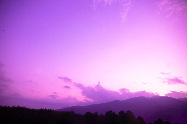 istock Dreamy purple sky background and sunlight with copy space, mountains and tree shadows 2238726156