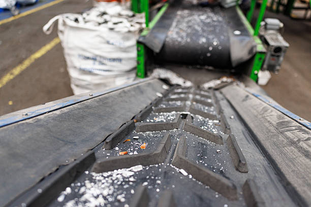 istock Conveyor line transporting scrap metal in factory 2238726442