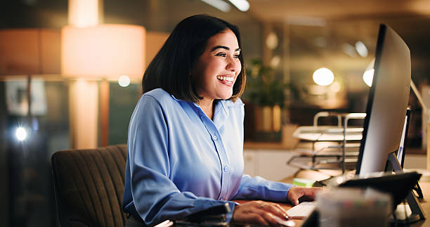 istock Office, woman and happy with computer, online or working late for data analysis, excited or success. Night, accountant and person with tech for financial report, reading and achievement for project 2238730501