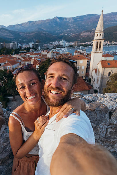 istock Happy Couple Taking Selfie on Coastal Town Wall 2238733011