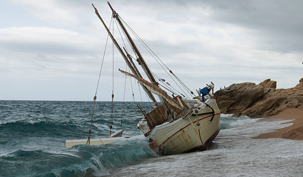 istock A Wrecked Ship Stranded on the Shoreline, Surrounded by Dramatic and Stormy Skies Above 2238740824