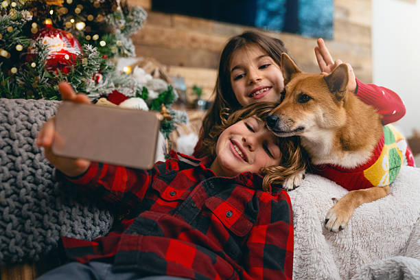 istock Kids taking Christmas selfie with dog 2238742303