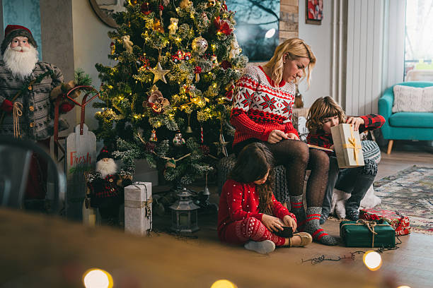 istock Family exploring Christmas gift together 2238742701