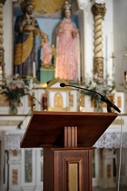 Color image depicting the wooden pulpit inside an ancient Anglican church dating back to the 1300s.