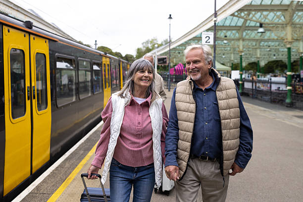 istock Couple Walking Hand in Hand on the Railway Platform 2238744691