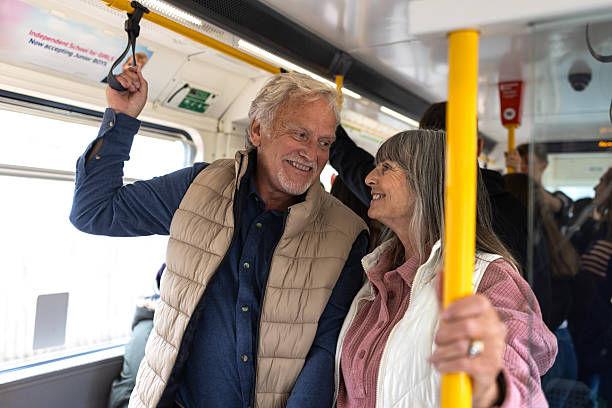 istock Content Couple Standing Together on a Metro 2238744764