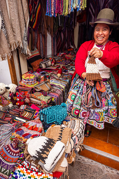 istock Peruvian woman spinning a wool in Pisac, Urubamba Valley 2238745130
