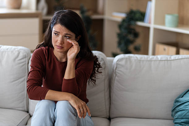 istock Crying Woman in Living Room 2238746768