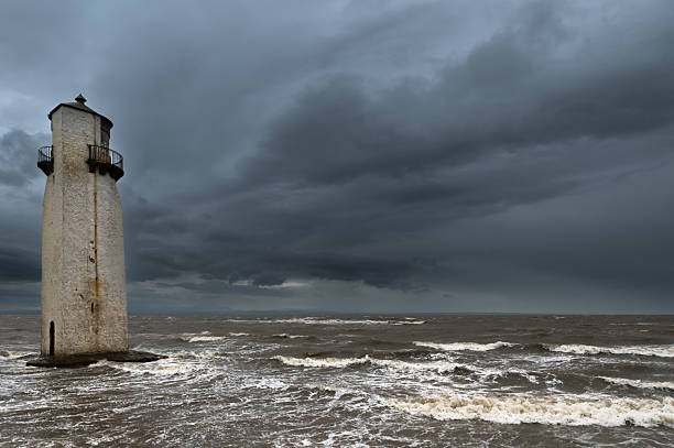 White lighthouse in stormy sea at Rattray Head