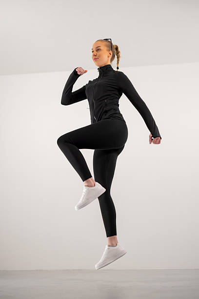 istock Fitness enthusiast jumping in activewear 2238752457