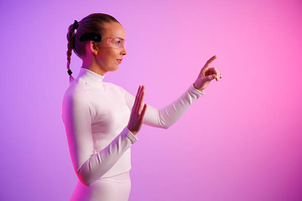 istock Woman in smartglasses standing by colored background 2238752671