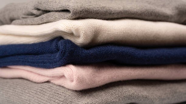 istock A group of warm sweaters isolated on a white background. 2238755284