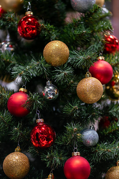 istock Artificial Christmas tree branches decorated with red, silver and gold balls. 2238756728