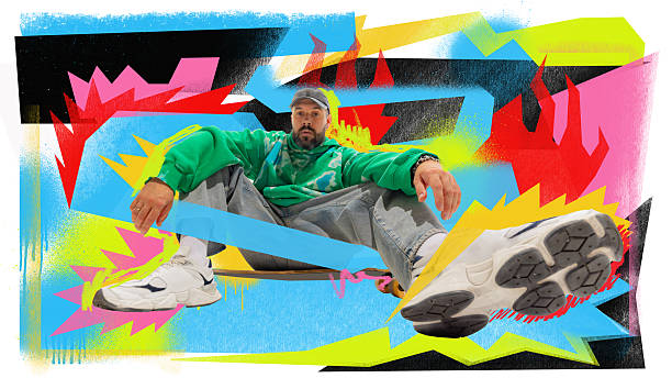 istock Creative digital artwork. Male model in green hoodie with abstract graffiti pop art background 2238758183