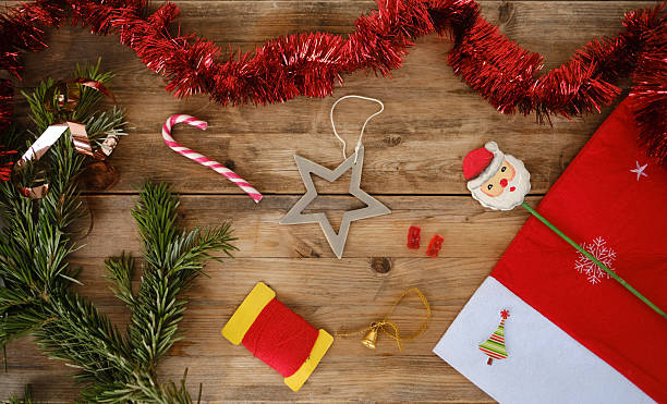 istock New Year layout for card with space for text, wooden retro style, Christmas tinsel, candy, festive ambiance with Christmas decorations and sweets, Greeting Cards Design 2238758314