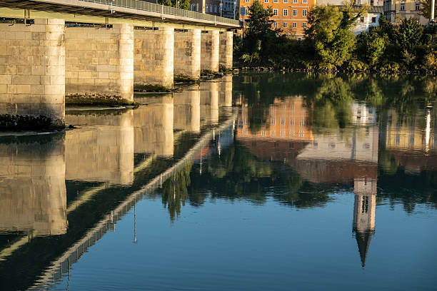 Passau, Bavaria, Germany: Church of St. Gertrude and Marienbrucke reflected in the Inn river on a sunny summer afternoon