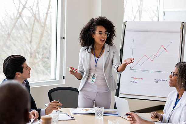 istock Diverse business professionals collaborate in a modern office setting during a presentation. 2238761446