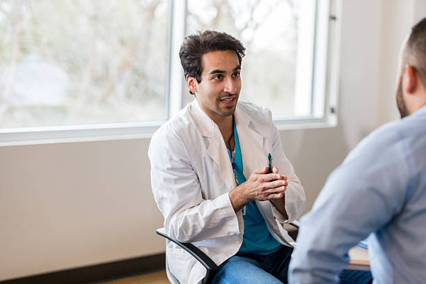 istock Doctor consulting with a patient in an office setting, discussing health concerns. 2238761502