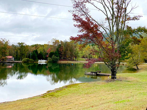 istock Autumn Lake with Dock and Reflections 2238769639