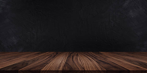 istock Dark wooden tabletop scene with black background 2238770208