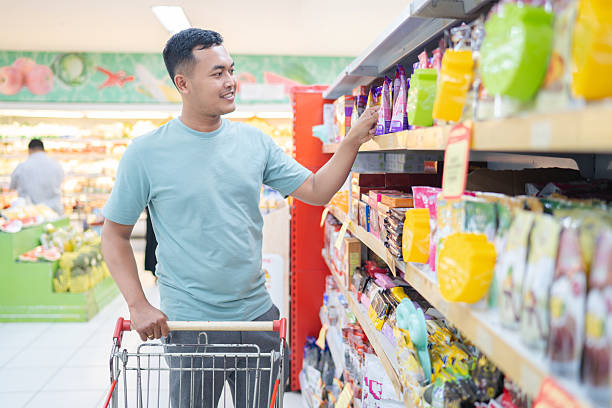 istock Male customer choosing products during grocery shopping 2238773189