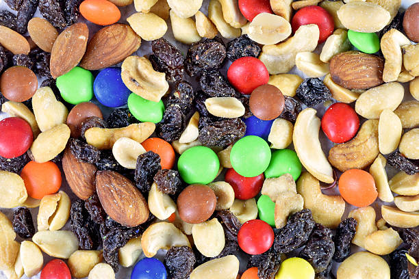 istock Colorful Candy And Nuts Trail Mix Background 2238773313